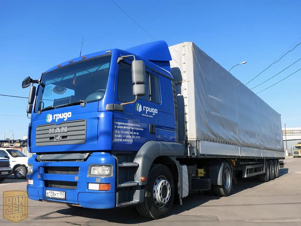 Тягач MAN TGA 18.480 с полуприцепом Schmitz S01, сдвижной тент 92 м3 - фото
