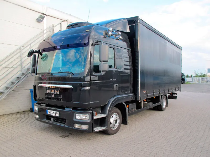 Грузовик тентованный MAN TGL 8.220, 2011 год | photo 0