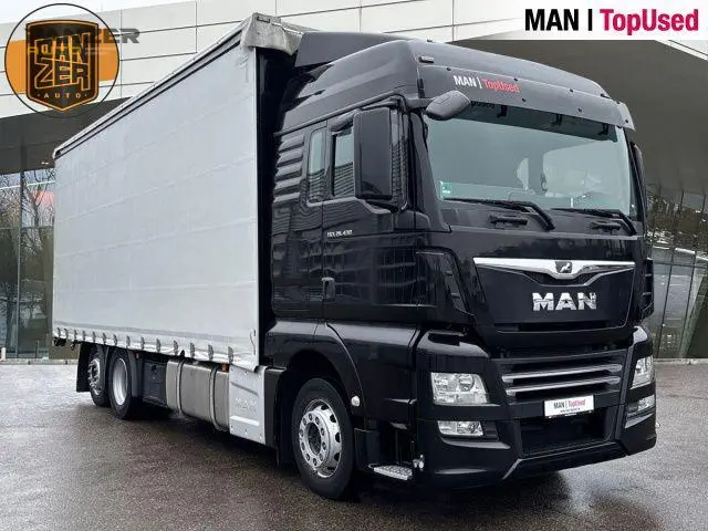 Грузовик тентованный MAN TGX 26.430, 2020 год | photo 0