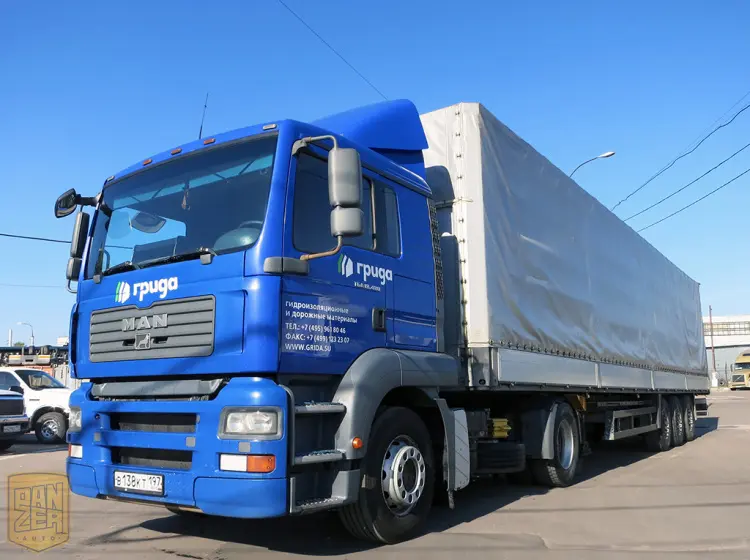 Тягач MAN TGA 18.480 с полуприцепом Schmitz S01, сдвижной тент 92 м3 - фото