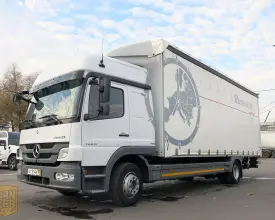 Грузовик тентованный Mercedes Atego 1229, 2012 год | photo 0