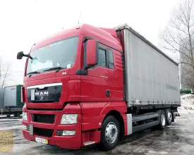 Грузовик тентованный MAN TGX 26.440, 2011 год | photo 0