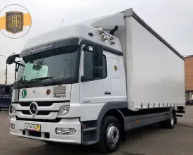 Грузовик тентованный Mercedes Atego 1229, 2011 год | photo 0