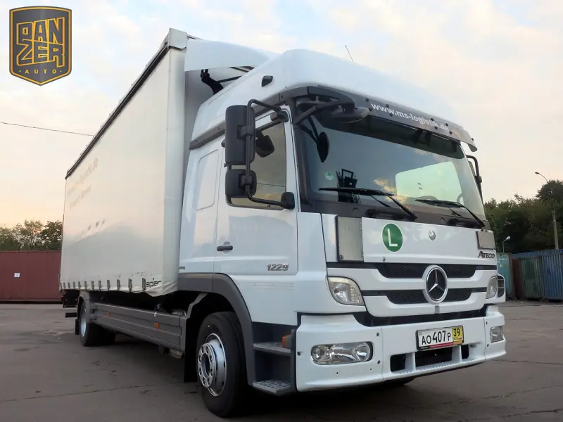 Грузовик тентованный Mercedes Atego 1229, 2011 год | photo 0