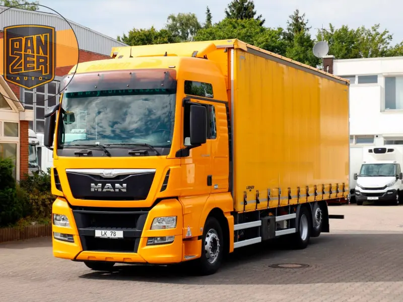 Грузовик тентованный MAN TGX 26.440, 2015 год | photo 0
