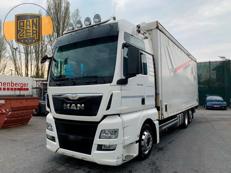 Грузовик тентованный MAN TGX 24.480, 2014 год | photo 0